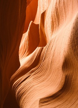 "Canyon Curves" — Limited Edition photograph available in different sizes on photographic paper or metal. Indian sandstone sculpted by the natural forces of flash floods and wind. Lower Antelope Slot Canyon on a Navajo Reservation in Arizona.